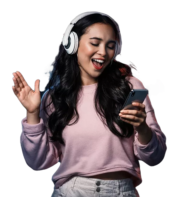 A woman wearing headphones, immersed in listening to music with a focused expression.